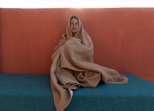 woman wrapped in blanket