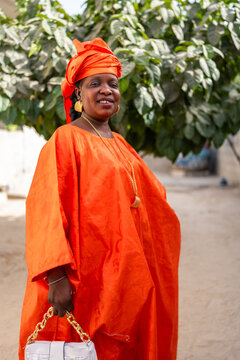 Senegalese woman wearing traditional clothes posing in street