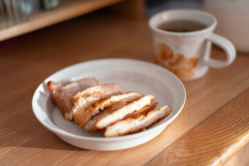 A healthy lunch for a Chinese worker in Asia, featuring grilled chicken and pork with potatoes, choy sum, and other vegetables, all illuminated by natural sunlight, making the meal appear very appetiz