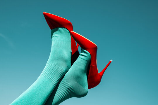 man wearing socks and high-heeled shoes