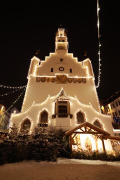 A large white building with a clock on the front