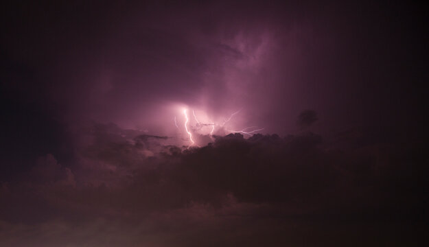 Purple Lightning Storm in Dark Clouds

 - Powered by Adobe