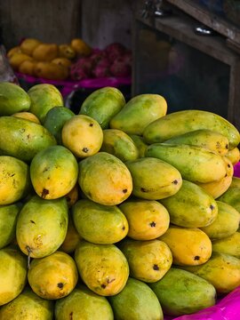 Fresh organic tropical  mango fruits selling in a retail shop