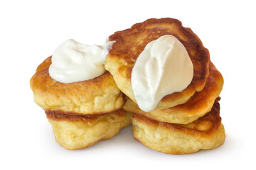 Thick homemade pancakes with sour cream on a white background. Fresh natural pancakes are isolated.