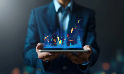 Businessman holding a tablet with a financial graph and trading chart icon on a virtual screen, business plan , stock market technology concept 