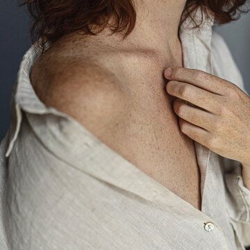 Sensual woman in beige shirt