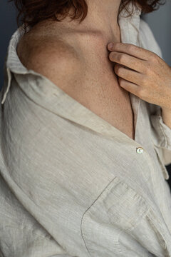 Unrecognizable woman in oversized shirt