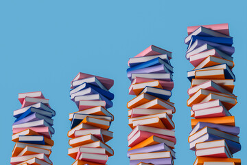 Colorful book stacks against blue background