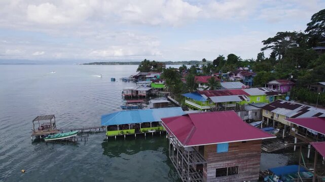 Aerial view showcasing Bocas Del Toro on Bastimentos Island in Panama. Coastal houses on stilts overlooking the serene water.