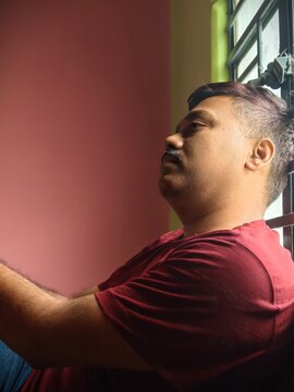 Different mood of an Indian man inside home 