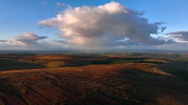 Bragan, County Monaghan, Ireland, September 2022. Drone pushes north across the rugged bog land towards Lough na Heery on the Irish border with Northern Ireland on a warm Autumn evening.