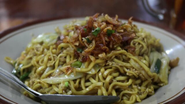 Mie Goreng Jawa or bakmi jawa or java noodle. Indonesian traditional street food noodles from Central Java or Yogyakarta.