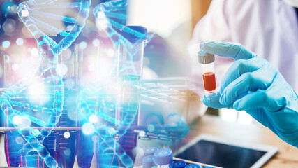 lab technician assistant analyzing a blood sample in test tube to research DNA at laboratory with microscope. Medical, pharmaceutical and scientific research and development concept.	