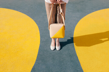 Stylish Woman with Handbag on Colorful Geometric Background