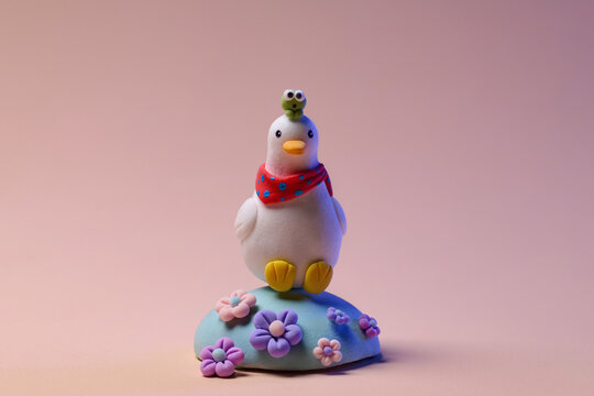 Cute Clay Duck Figurine With Frog On Head And Colorful Flowers