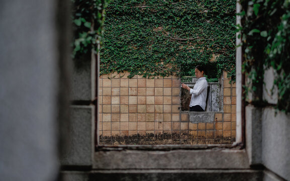 The woman in the ruins.
