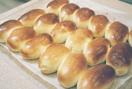 Pirozhki buns on parchment baking paper