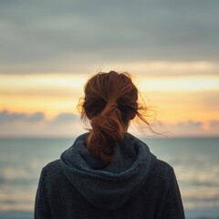 Fototapeta premium serene sunset view ocean person gazing into horizon, embodying peace reflection nature.