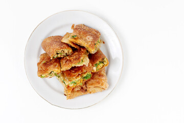 Martabak Telor or Martabak Telur. Savory pan-fried pastry stuffed with egg, meat and spices. isolated on a white background, good for commercial or article