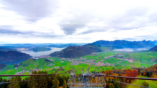 Autumn landscape with aerial cableway to Stanserhorn Mountain seeing beautiful autumn season view of the Stans valley floor, Lake Lucerne, Engelberg valley and Obwalden in Switzerland