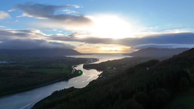 Flagstaff, County Down, Northern Ireland, November 2022. Drone gradually ascends while facing south east over the Newry river with Warrenpoint and Carlingford Lough in the distance during sun rise.