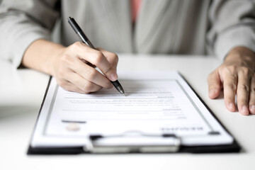 Business woman employer holding resume hiring recruit looking cv resume to hire candidates, analyzing information before job interview. Recruitment concepts