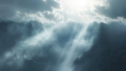 Sunlight streaming through clouds above dramatic mountain terrain creating a stunning contrast of light and shadow