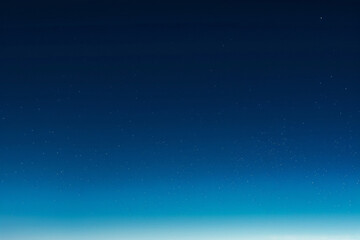 Sky blue to navy gradient.