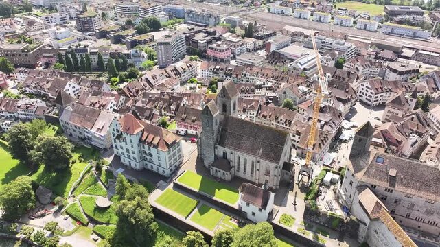 Historic church in Rapperswil - Jona. Traditional period houses on the banks of Lake Z&uuml;richsee. Living in Switzerland surrounded by amazing mountain nature in summer