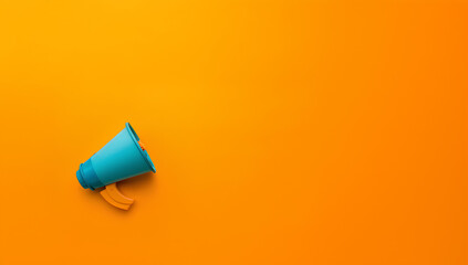 Megaphone on an orange background with space for text, refer a friend and affiliate promotion concept banner background with copyspace