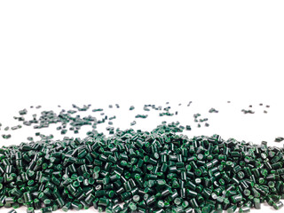 Forest green masterbatch granules on a white background. Color pigment carrier polymer in the plastics industry