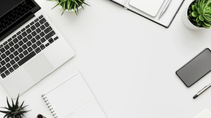 Modern clean workspace with laptop, smartphone, notebooks, and plants on a white desk. Minimalistic office setup for productivity.