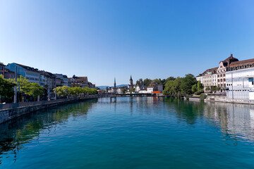 Scenic view of Limmat River at the old town of Swiss City of Zürich on a sunny summer day. Photo taken August 6th, 2024, Zurich, Switzerland.