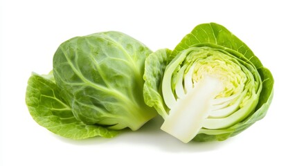 Fototapeta premium Fresh Brussels sprout halved, showcasing its compact layers and vibrant green leaves. Isolated crisply against a pure white background