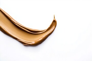 A close up of a liquid foundation on a white surface