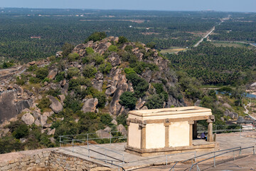 An old temple on top of a hill surrounded by rocky terrain in the village of Shravanabelagola