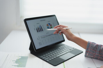 Asian businesswoman. Online freelancer. Confident investor working at laptop computer, PC. and...