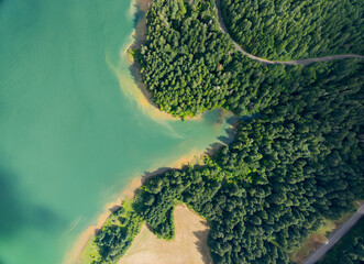 A beautiful lake with a green forest in the background
