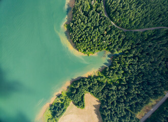A beautiful lake with a green forest in the background