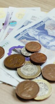 British pounds coins and banknotes vrticals format