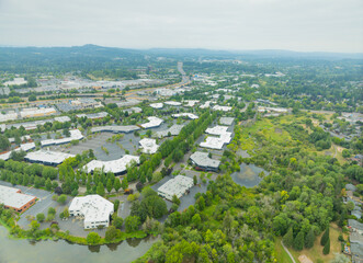 A city view from above with a lot of buildings and a lake