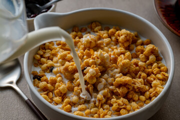Milk and granola.
Breakfast image.
