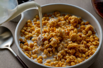Milk and granola.
Breakfast image.
