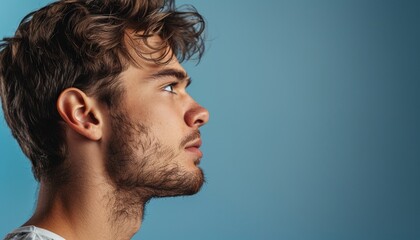 Fototapeta premium Young Man Profile View, Detailed Portrait, Attractive Male, Modern Style, Bright Background, Banner with Copy Space