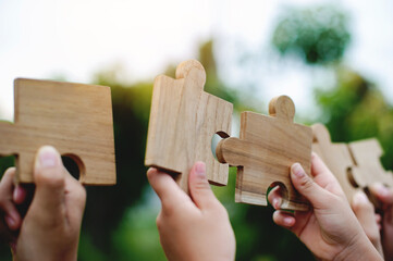 Jigsaw puzzle of unity, cooperation among groups, teamwork, team connection and support