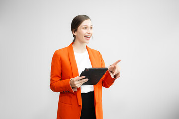 Portrait photo of young beautiful woman feeling happy and holding smart phone, tablet and laptop with black empty screen on white background can use for advertising or product presenting concept.