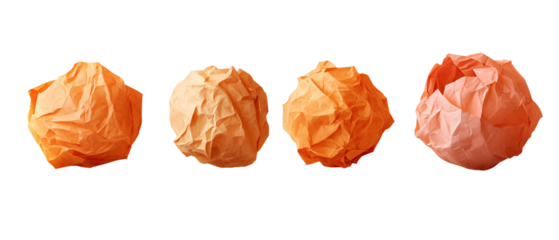 Four Crumpled Orange Paper Balls Isolated on Black Background