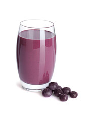 Tasty acai juice in glass and berries isolated on white