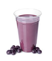 Tasty acai juice and berries isolated on white