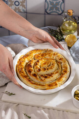 Traditional Greek cuisine. Spanakopita, savory pie. Homemade Greek phyllo dough pie filled with spinach and feta cheese.